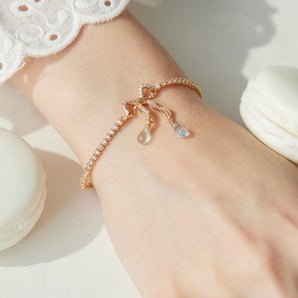 Blue Topaz Gold Bow Tennis Bracelet - Alice | LOVE BY THE MOON
